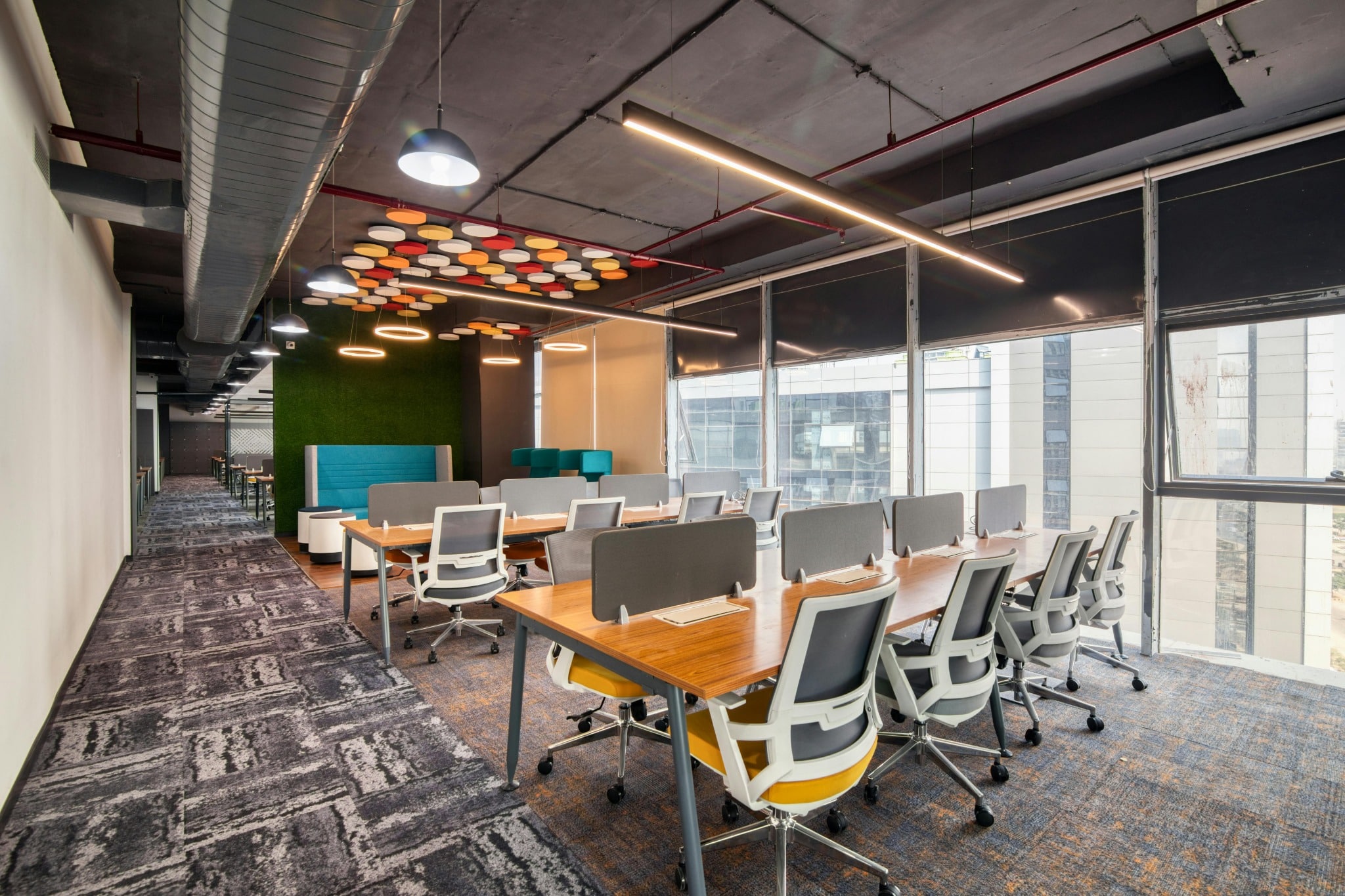 Modern office workspace with desks and meeting area